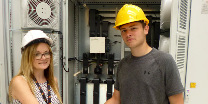 Student Robert Jones shakes hands with an EXHEAT staff